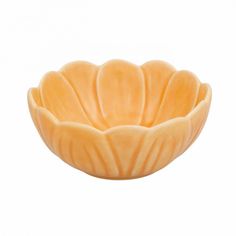 a yellow flower shaped bowl on a white background