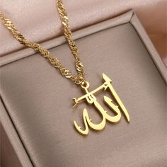 Custom Allah Name Necklace in 18K gold filled stainless steel personalized, and custom made with your desired color.  Our Custom Calligraphy Arabic jewelry is handcrafted with 18K Gold-filled Stainless Steel meaning it is waterproof, hypoallergenic, NON TARNISH, and everlasting!  These are the perfect gifts for Eid, Ramadan, and any Islamic special occasions. KEY FEATURES: -Handcrafted with 316 stainless steel: waterproof, NON TARNISH, rust-resistant, hypoallergenic and everlasting. -Double laye Gifts For Eid, Allah Necklace, Allah Name, Calligraphy Arabic, Arabic Jewelry, Roses Book, Islamic Jewelry, Eid Ramadan, Allah Names