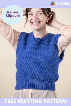 a woman wearing a blue knitted sweater with the text free knitting pattern on it