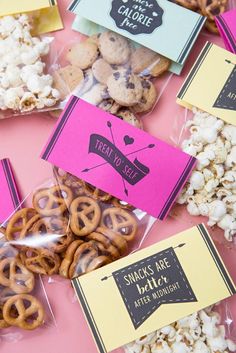 some snacks are sitting on a pink table