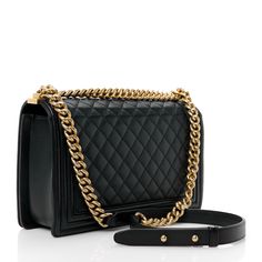 This is an authentic CHANEL Calfskin Quilted New Medium Boy Flap in Black. This stylish shoulder bag is crafted of diamond-quilted calfskin leather in black with linear quilted borders. The bag features an aged gold chainlink shoulder strap with a leather shoulder pad and an aged gold boy CC push lock on the crossover flap. This opens to a black fabric interior with zipper and patch pockets. Stylish Shoulder Bag, Diamond Quilt, New Media, Fashion History, Black Fabric, Chanel Bag, Shoulder Pads, Classic Black, Crossover