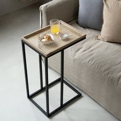 a table with a tray on it next to a couch