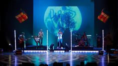 a group of people standing on top of a stage