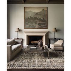 a living room filled with furniture and a painting on the wall over a fire place