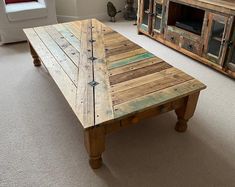 a coffee table made out of pallet wood