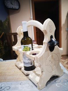 a wine bottle holder made out of wood