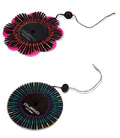 two circular objects with wires attached to the sides, one is black and one is pink