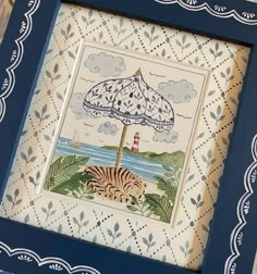 a blue frame with a picture of a tiger under an umbrella