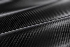 black and white photograph of carbon fiber fabric