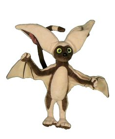 a stuffed animal that looks like a bat with big eyes and large wings on its back