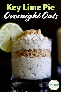 a close up of a dessert in a glass on a table with lime and oatmeal