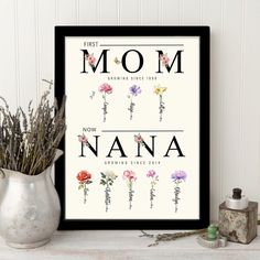 a framed poster with the words'first mom, now nana'and flowers