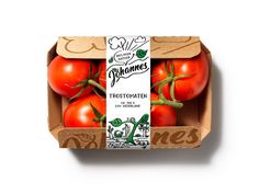 a cardboard box filled with tomatoes on top of a white surface and the packaging is empty