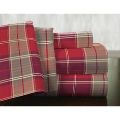 the sheet set is red and gray plaid