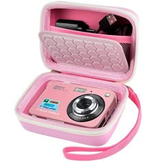 a pink camera in a pink case on a white background