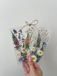 SET OF 3 handmade, aesthetic, wildflower pressed flower bookmarks to make your reading experience even more lovely. These laminated bookmarks are perfect to gift to a bookish friend, or keep for yourself! Minimal & elegant floral designs.  *PLEASE NOTE Placement of flowers/exact flower type may vary! My bookmarks are all unique :) I'm a college student running this shop alone, so my processing time is 1-2 weeks!  I will not resend bookmark orders until a full 4 weeks have passed without delivery Dried Flowers Bookmark, Bookmarks To Make, Pressed Flower Bookmarks, Laminated Bookmarks, Flower Bookmarks, Bookmark With Tassel, Handmade Aesthetic, Birthday Picnic, Tassel Bookmark