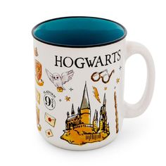 a harry potter mug with hogwarts on it