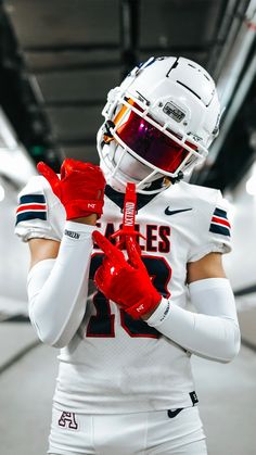 a football player wearing a helmet and gloves