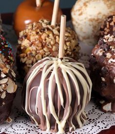 there are many different types of chocolates on the table and one is covered in sprinkles