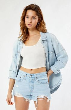 These 501 Light Blue Frayed Denim Shorts from Levi's are the perfect Instagram-worthy piece to complete your summer look. The classic blue wash and high-rise fit flatters any body type while the frayed hem adds laidback style. Whether you're hitting the beach or brunch with friends, these shorts will photograph beautifully from any angle and flatter your social posts. Made with vintage details like rolling stitching and distressing, these shorts transport you to easy, effortless summers past and become your go-to casual piece all season long. Laidback Style, Summer Shorts Outfits, Vintage Details, Outfit Challenge, Light Blue Shorts, Frayed Denim, Blue Jean Shorts, Levi's 501, Instagram Worthy