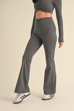 Expertly designed for a comfortable and stylish fit, our Ruched Waist Flare Leggings feature a flattering ruched waistband and soft, stretchy fabric. Perfect for any workout or everyday wear, these leggings provide both fashion and function. Elastane Activewear With Wide Waistband, Gray High Waist Stretch Yoga Pants, Compression Workout Bottoms With Ribbed Waistband, Fitted Elastane Activewear With Wide Waistband, Workout Compression Bottoms With Ribbed Waistband, Fitted High-waist Leggings With Ribbed Waistband, Fitted High Waist Leggings With Ribbed Waistband, Fitted Yoga Leggings With Ribbed Waistband, Fitted Athleisure Leggings With Ribbed Waistband