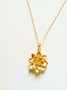 Gold or silver lotus flower necklace, gold flower necklace,14k gold filled chain or 925 sterling silver chain as of your choice A beautiful golden lotus flower strung onto fine 14k gold filled chain not gold  plated or 925 sterling silver chain very high quality . A lovely and elegant necklace for mom, grandma,mother-in-low, sister,daughter or whoever is very close to your heart for given as a one of a kind gift  Comes in a  beautiful ribbon gift box 18mm * 18mm gold or silver plated brass lotus Dainty Flower Charm Jewelry For Mom, Dainty Jewelry With Flower Charm As Gift For Mom, Dainty Flower Charm Jewelry As Gift For Mom, 14k Gold Flower Pendant Jewelry Gift For Mom, 14k Gold Filled Flower Necklace, 14k Gold-filled Flower Necklace, 14k Gold Filled Yellow Gold Jewelry For Bridesmaid Gift, Delicate 14k Gold Filled Jewelry With Flower Charm, Delicate 14k Gold-filled Jewelry With Flower Charm