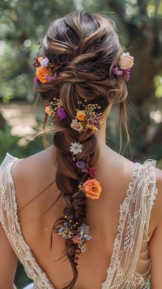 the back of a woman's head, with flowers in her hair and braid