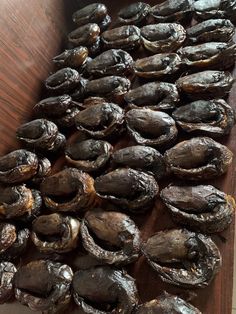 a pile of mushrooms sitting on top of a wooden table