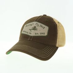 Our trucker hat has an unstructured crown with the Murray's Fly Shop name on the front. The visor is fully curved and one size fits all with the open back snap closure. Made of cotton twill with soft mesh back. Colors: Olive with tan mesh & kelly green under the visor or Brown with tan mesh & kelly green under the visor Khaki Trucker Baseball Cap, Khaki Trucker Style Baseball Cap, Khaki Trucker-style Baseball Cap, Adjustable Mesh Trucker Hat With Curved Visor, One Size Mesh Back Baseball Cap, Casual Hat With Mesh Back And Curved Visor, Adjustable Mesh Back Cap, Baseball Cap With Mesh Back And Curved Bill, Adjustable Trucker Hat With Curved Visor