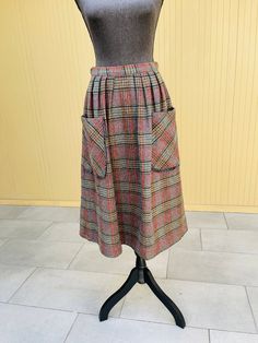 Leo Narducci vintage a-line plaid wool skirt with big front pockets Size 12  Measures: 27" waist (high waist) and 29" long Great condition Fully lined Subtle front pleats near the top  Metal slide tab and zipper back closure  Dry Clean Only See pictures for additional details Retro Winter Skirt With Pockets, Plaid Skirt With Pockets For Winter, Vintage A-line Skirt For Fall, Retro Pleated Bottoms For Fall, Vintage Knee-length Winter Bottoms, Vintage Knee-length Bottoms For Winter, Knee-length Skirt With Pockets For Fall, Knee-length Fall Skirt With Pockets, Vintage Pleated Bottoms For Fall