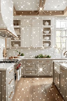 a kitchen with white stars on the ceiling and wooden flooring in front of it