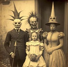 an old photo of three people in halloween costumes