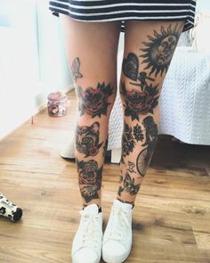 the legs and ankles of a woman with tattoos