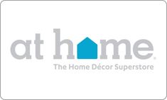 the home decor store at home logo on a white background with grey and blue letters