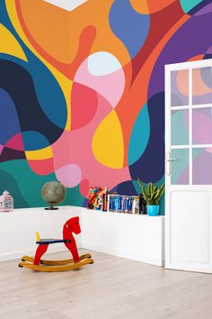 a brightly colored room with a rocking horse