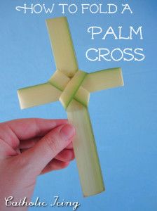 a hand holding a paper cross with the words how to fold a palm cross on it