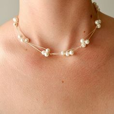 This handmade pearl necklace is adorable and unique. It can add a beachy vibe to any outfit. The necklace is 16 inches in length and comes with an extender chain attached for an extra 1.5 inches of length, so the necklace can be adjusted to your preference. The necklace is made with 0.5mm dark brown nylon cord and faux pearl beads that are high quality and made from glass. The clasp of the necklace is made of stainless steel. Adjustable Pearl Necklace For Gift, Handmade Adjustable Minimalist Pearl Necklace, Adjustable Wire Wrapped Pearl Necklace Gift, Adjustable Wire Wrapped Pearl Necklace As Gift, Adjustable Cream Pearl Necklace, Adjustable Cream Single Strand Necklace, Handmade Adjustable Pearl Necklaces, Handmade Adjustable Cream Pearl Necklace, Adjustable Handmade Cream Pearl Necklace