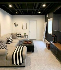 a living room filled with furniture and a flat screen tv