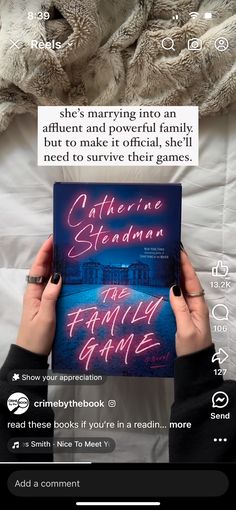 someone is holding up a book in their hand while laying on a bed with the caption catherine sedaman and family game