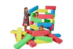 two girls and one boy are playing with colored blocks in an advertisement for rull build it