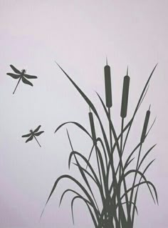 two dragonflies are flying over tall grass