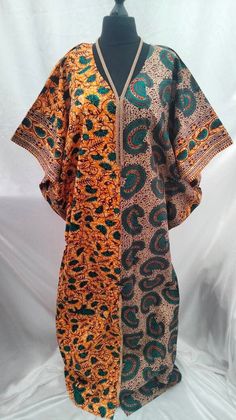 A bold handmade Ankara boubou, also known as a kaftan, long dress or even a boubou gown. Whatever you decide to call it the free flowing floor length dress will definitely have heads turning.  This dress is a one size fits all (from size 10- 20). Please feel free to contact me if you have any questions. Green Tunic Kaftan For Festivals, Traditional Green Dress With Kimono Sleeves, Green Traditional Kaftan With Kimono Sleeves, Traditional Green Kaftan With Kimono Sleeves, Green Kaftan With Traditional Patterns, Traditional Short Sleeve Green Kaftan, Traditional Orange Free Size Kaftan, Traditional Green Short Sleeve Kaftan, Traditional Green Kaftan With Short Sleeves