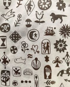 a bunch of black and white tattoos on a piece of paper