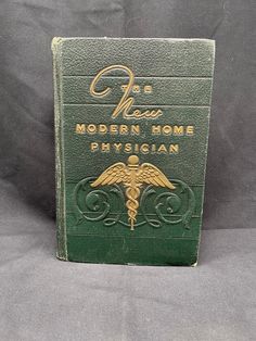 Vintage Medical "The New Modern Home Physician" Edited by Robinson, PH.C, M.D. 1949 This vintage medical book titled "The New Modern Home Physician" is a valuable addition to any collection. Edited by Victor Robinson, PhD. M.D. and published by Wm. H. Wise & Co. Inc in 1948, this hardcover book is an original print and written in English. The book covers various topics related to medicine and would be useful for any medical professional or enthusiast. The book was printed in the United States and is a rare find for collectors of antiquarian books. Medical Books To Read, Villain Character, Vintage Medical, Antiquarian Books, Reference Books, Book Title, Medical Professionals, Hardcover Book, Original Prints