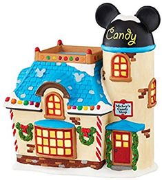 a mickey mouse house is decorated for christmas