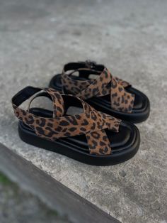 Handcrafted from leopard print suede leather upper and leather lining, the Emma Sandals are your go-to footwear for summer looks. A soft square toe design along with a thong design and buckle strap closure, these sandals come with a soft memory foam insole for your day long comfort. You will love and enjoy your Emma sandals for sure. PRODUCT INFORMATION * High quality leopard print suede leather upper (available in other colors on request) * Leather lining * Thong design * Adjustable ankle strap Leopard Print Open Toe Sandals For Vacation, Leopard Print Round Toe Sandals For Vacation, Flat Heel Leopard Print Sandals For Summer, Leopard Print Flat Heel Sandals For Summer, Summer Sandals With Leopard Print And Flat Heel, Summer Leopard Print Sandals With Round Toe, Summer Leopard Print Platform Sandals, Leopard Print Leather Ankle Strap Sandals, Leopard Print Platform Sandals With Round Toe