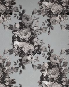 black and white floral wallpaper on a gray background