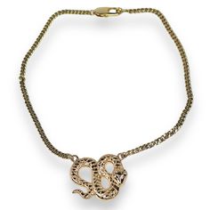 Embrace bold sophistication with the Python Necklace, a striking piece designed to capture attention. This gold-filled snake necklace features an intricately detailed coiled serpent pendant, symbolizing power and transformation. Set on a sturdy yet elegant chain, the serpent pendant boasts a polished finish, making it the perfect statement piece for any occasion. Lightweight and versatile, this snake necklace seamlessly elevates your style, whether for a night out or everyday wear. The timeless design and luxurious gold tones make this necklace an essential addition to your jewelry collection. Exposure to the salt from sweat can cause your pieces to become dull. Be mindful that perfume, hairspray and hand lotions may tarnish your gold filled jewelry due to the harsh chemicals they contain. Halo Jewelry, The Serpent, Gold C, Snake Necklace, Hand Lotion, Watch Necklace, Polish Jewelry, Gold Filled Jewelry, Necklace Sizes