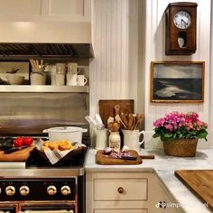 the kitchen counter is covered with pots, pans and other cooking utensils