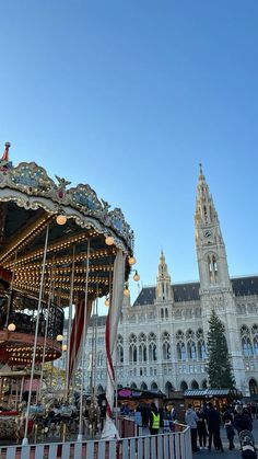 a merry go round in front of a large building